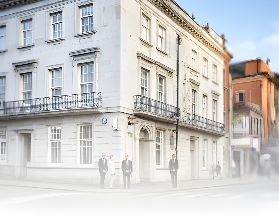 Solicitors standing outside a Jamestown Road office in Dublin on a bright weekday morning