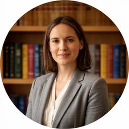 Solicitor Saoirse Whelan at the Jamestown Road office, standing beside a bookshelf of law reports